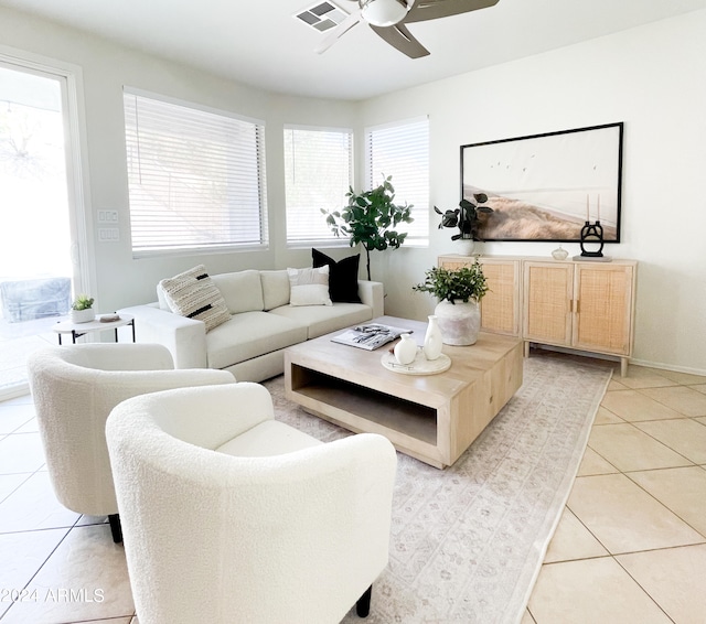 tiled living room with ceiling fan