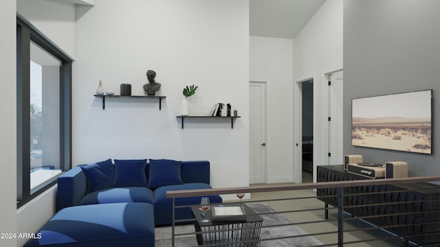 living room featuring plenty of natural light and a high ceiling