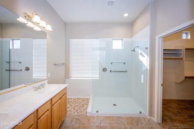 bathroom with vanity and walk in shower