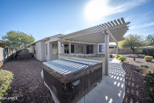 view of patio featuring a pergola, central air condition unit, and a hot tub