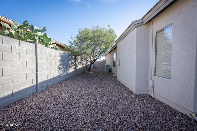 view of yard with central AC