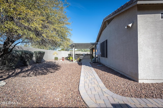 view of yard featuring a pergola and a patio