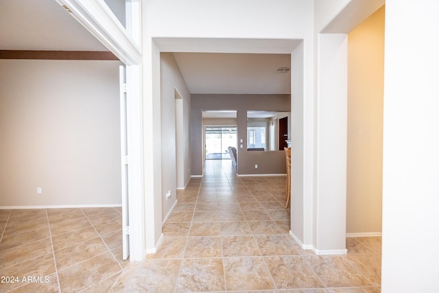 hallway featuring light tile patterned flooring