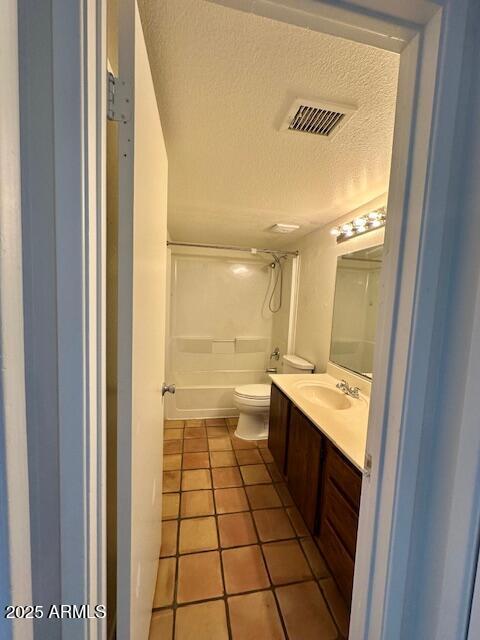 14002 N 49th Ave Unit 1021, Glendale, AZ 85306 - bathroom featuring vanity, a textured ceiling, shower / bath combination, and tile patterned floors