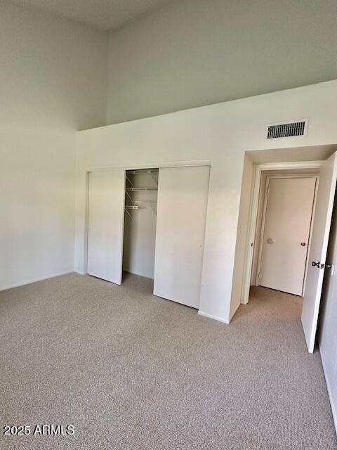 14002 N 49th Ave Unit 1021, Glendale, AZ 85306 - unfurnished bedroom with a closet and carpet