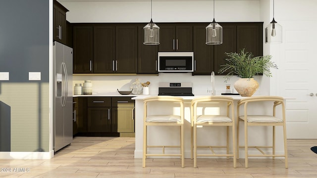 kitchen with dark brown cabinetry, hanging light fixtures, stainless steel fridge with ice dispenser, light hardwood / wood-style flooring, and stove