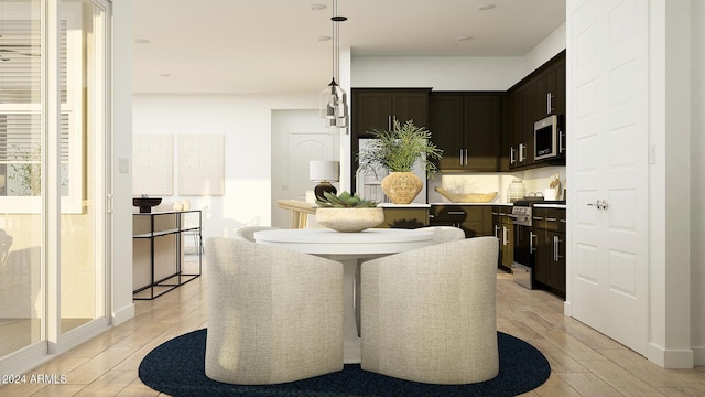 dining area with light hardwood / wood-style flooring