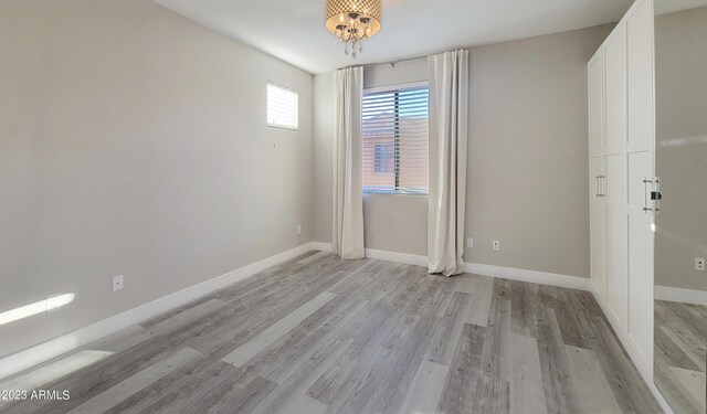 spare room featuring light hardwood / wood-style flooring