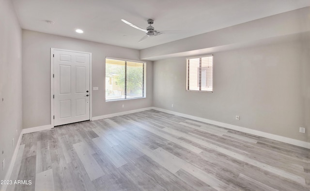 unfurnished room featuring ceiling fan and light hardwood / wood-style flooring