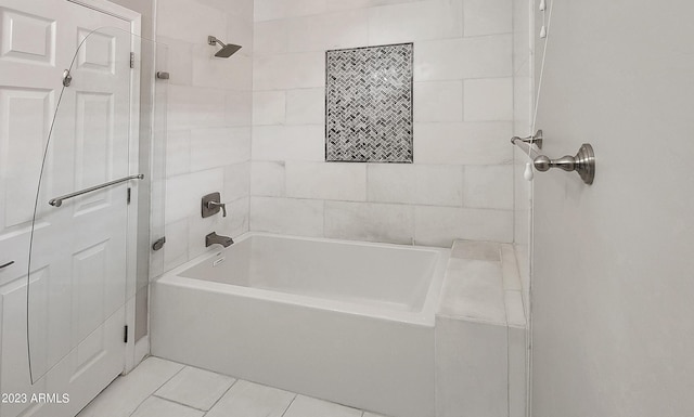 bathroom with tiled shower / bath and tile patterned floors