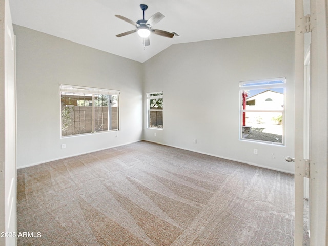 unfurnished room with vaulted ceiling, ceiling fan, and light carpet