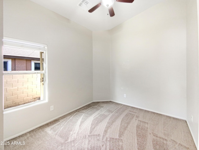 carpeted empty room with ceiling fan