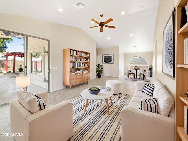 living room with light tile patterned flooring and vaulted ceiling