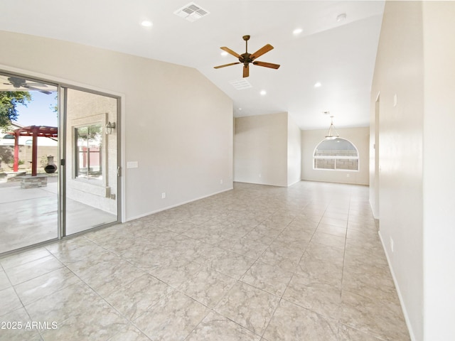 empty room with ceiling fan and lofted ceiling