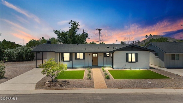 6908 E Windsor Ave, Scottsdale, AZ 85257 - ranch-style house with a lawn, concrete driveway, and a carport