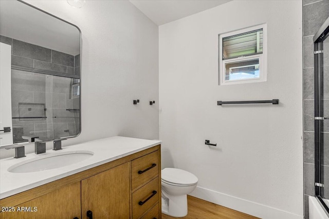 6908 E Windsor Ave, Scottsdale, AZ 85257 - bathroom with vanity, a shower with door, and wood finished floors
