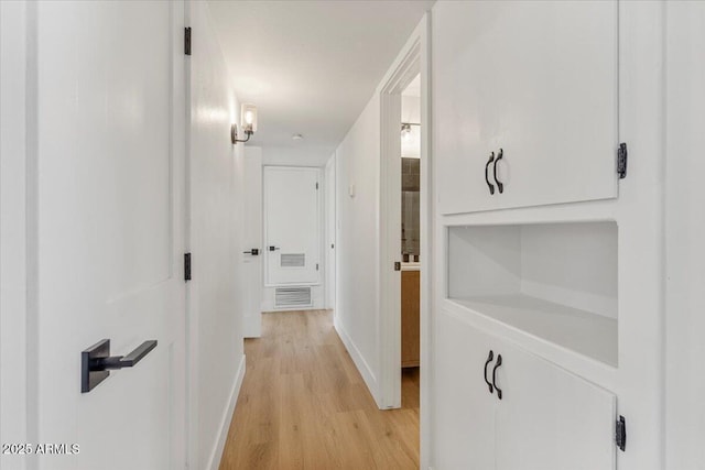 6908 E Windsor Ave, Scottsdale, AZ 85257 - hallway with light wood finished floors and baseboards