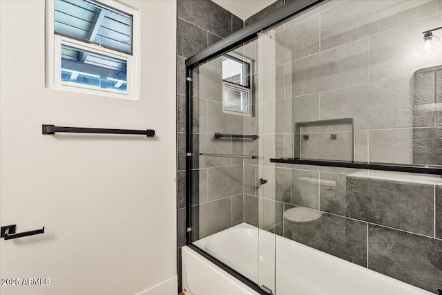 6908 E Windsor Ave, Scottsdale, AZ 85257 - bathroom featuring bath / shower combo with glass door and baseboards