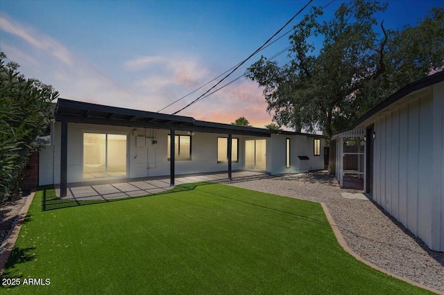 6908 E Windsor Ave, Scottsdale, AZ 85257 - back of property with a patio area and a lawn