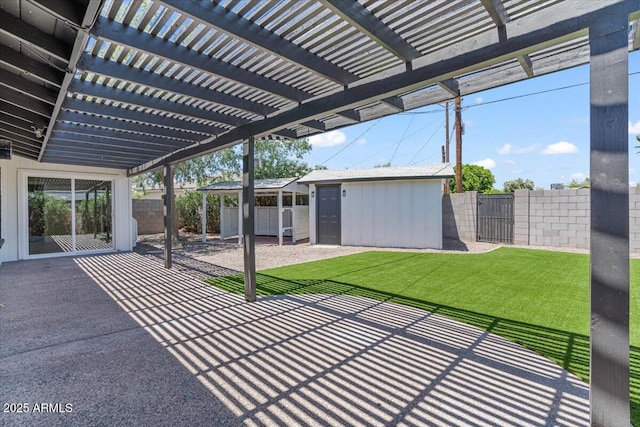 6908 E Windsor Ave, Scottsdale, AZ 85257 - fenced backyard featuring a patio, a pergola, and an outbuilding