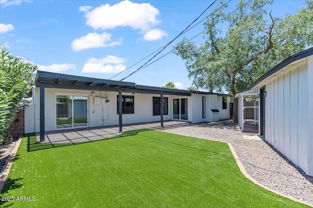 6908 E Windsor Ave, Scottsdale, AZ 85257 - back of house featuring a lawn and a patio