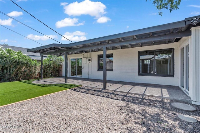 6908 E Windsor Ave, Scottsdale, AZ 85257 - rear view of property with a patio and brick siding