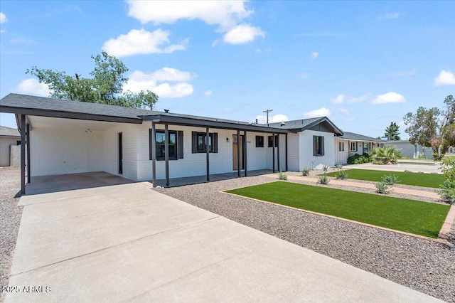 6908 E Windsor Ave, Scottsdale, AZ 85257 - ranch-style home with a front lawn, a carport, brick siding, and driveway