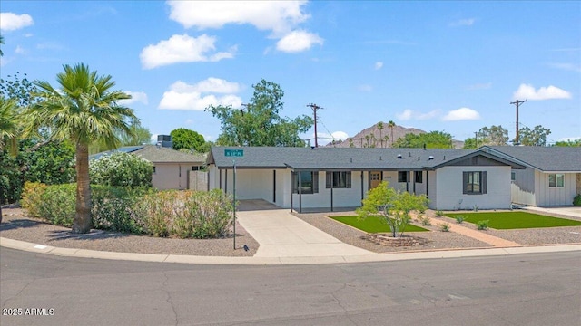 6908 E Windsor Ave, Scottsdale, AZ 85257 - ranch-style house featuring driveway, a carport, and a mountain view