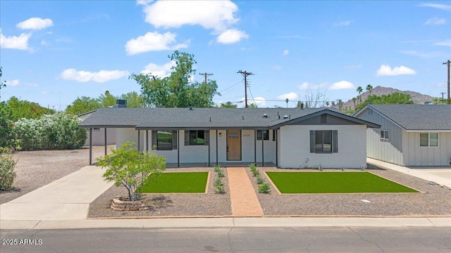 6908 E Windsor Ave, Scottsdale, AZ 85257 - ranch-style home featuring a front yard and covered porch