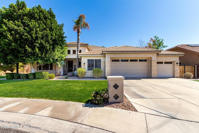 prairie-style home with a garage, driveway, a front lawn, and stucco siding