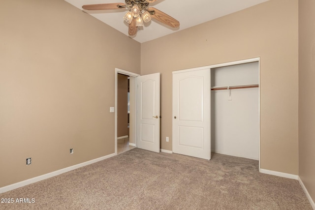 unfurnished bedroom with carpet, baseboards, a closet, and ceiling fan