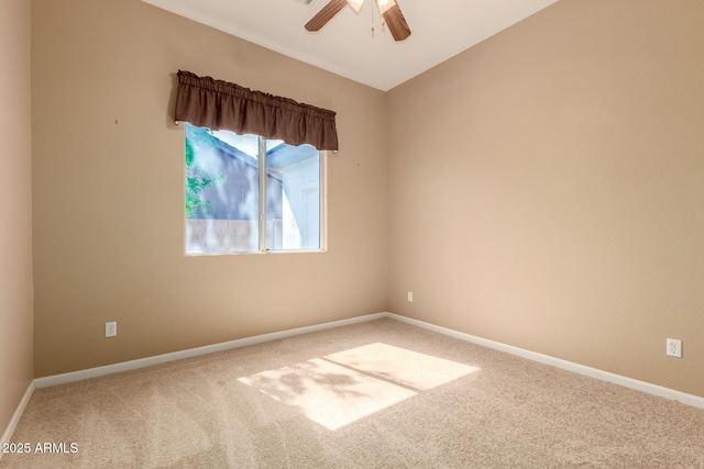 spare room featuring baseboards, carpet floors, and ceiling fan