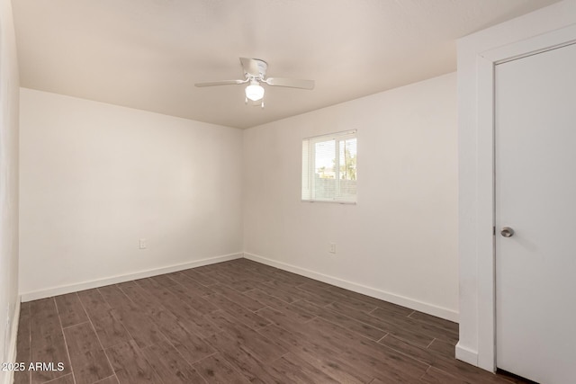 unfurnished room featuring dark hardwood / wood-style floors and ceiling fan