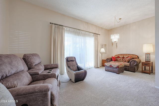 carpeted living room featuring a textured ceiling and a notable chandelier