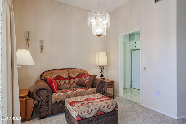 sitting room with light colored carpet and a chandelier