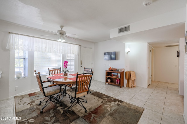 dining area featuring ceiling fan and light tile patterned floors