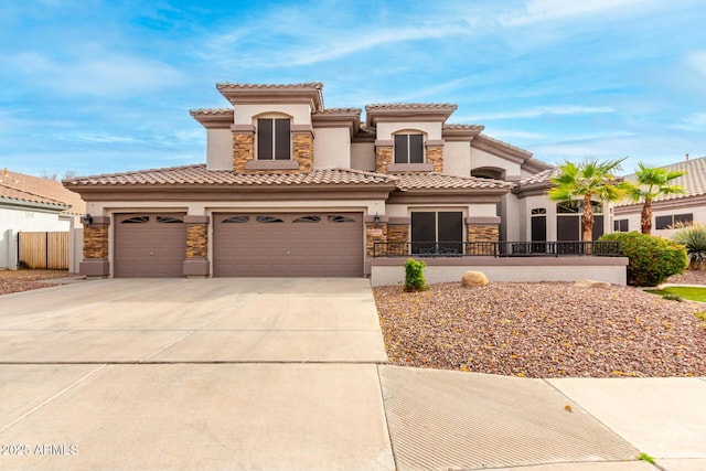 mediterranean / spanish house with a garage