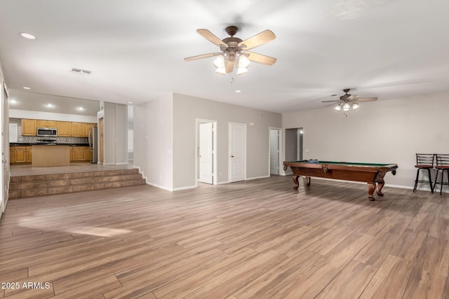 game room featuring pool table, ceiling fan, and light hardwood / wood-style flooring