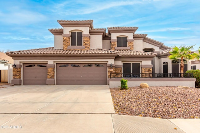 mediterranean / spanish-style home with a garage