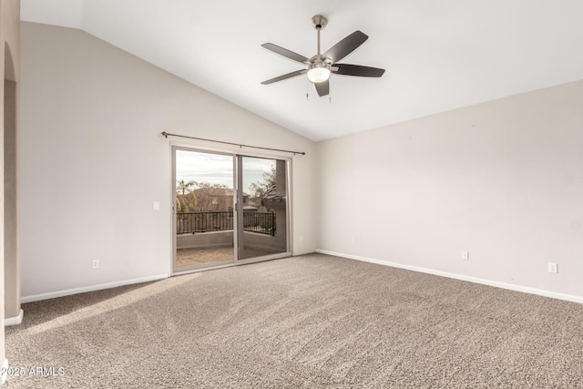 carpeted spare room with ceiling fan and lofted ceiling