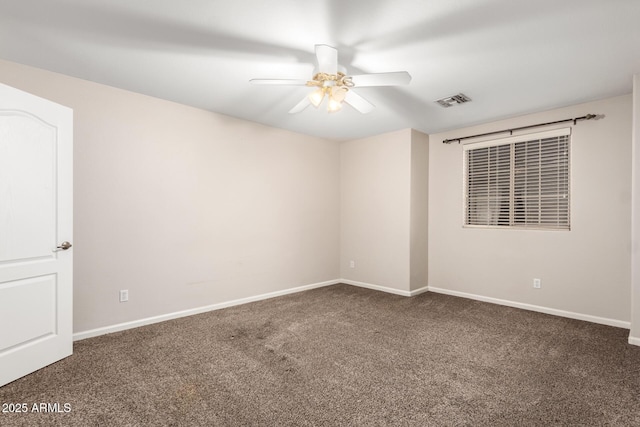 carpeted spare room featuring ceiling fan