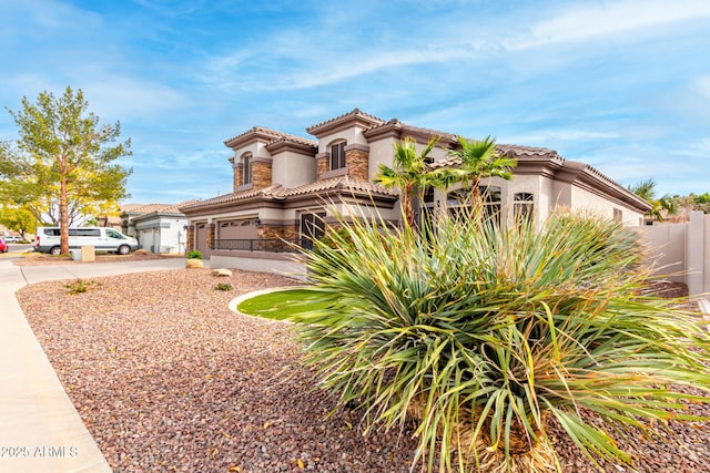 mediterranean / spanish-style home featuring a garage