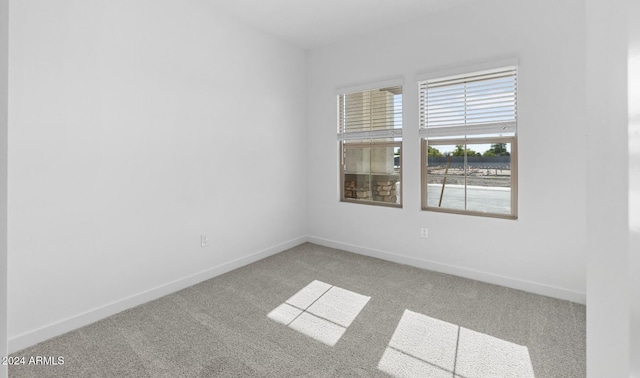 empty room with carpet flooring