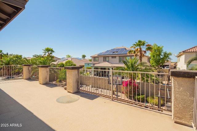 view of patio featuring a residential view and a balcony