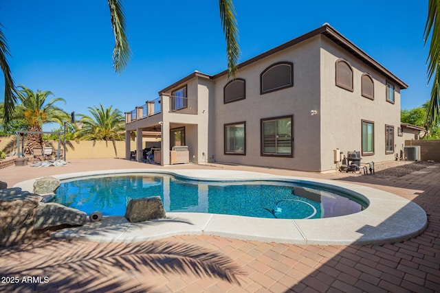 view of swimming pool featuring fence, a patio area, a fenced in pool, and central air condition unit