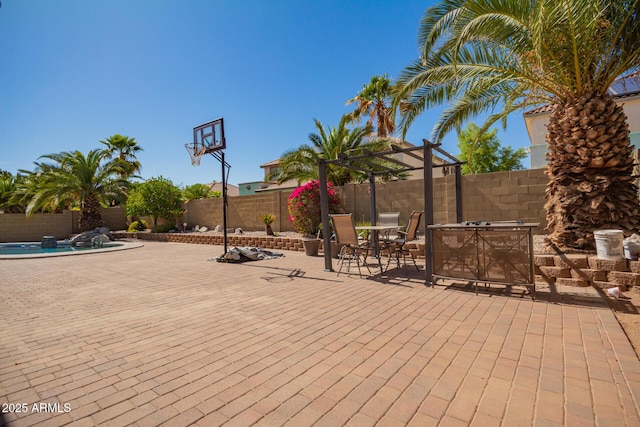 view of patio with a pergola, a fenced backyard, and a fenced in pool