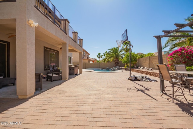 exterior space with a patio area, a fenced backyard, a fenced in pool, and ceiling fan