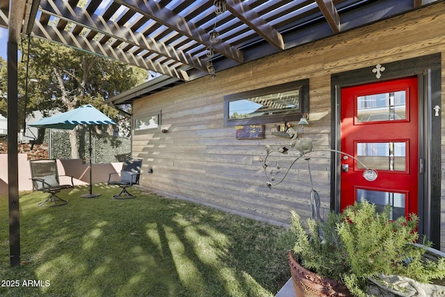 exterior space featuring a pergola and a yard