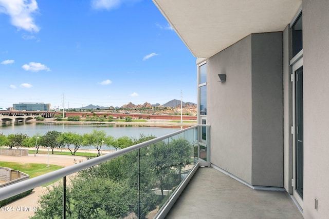 balcony featuring a water view