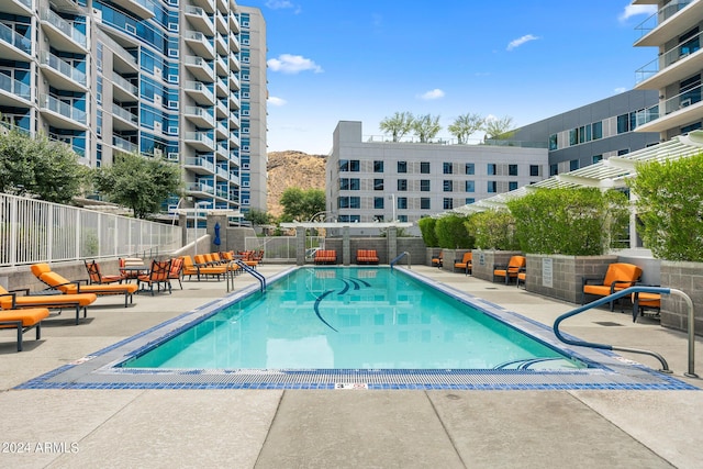 view of swimming pool featuring a patio area